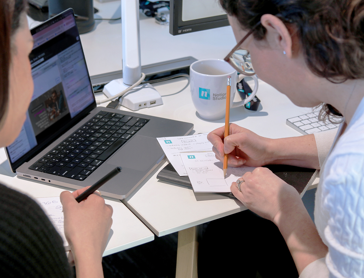 Creative Director and another team member refining the creative strategy.